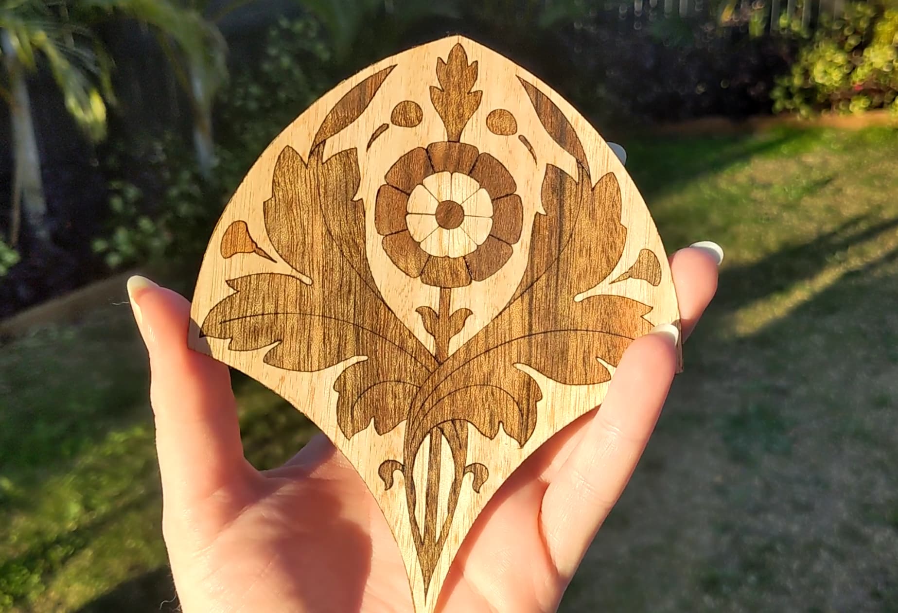 First time trying to do an inlay design by laser engraving the coaster and  then laser cutting the veneer. Not perfect, but given the 6 failed attempts  not in the picture, I'm
