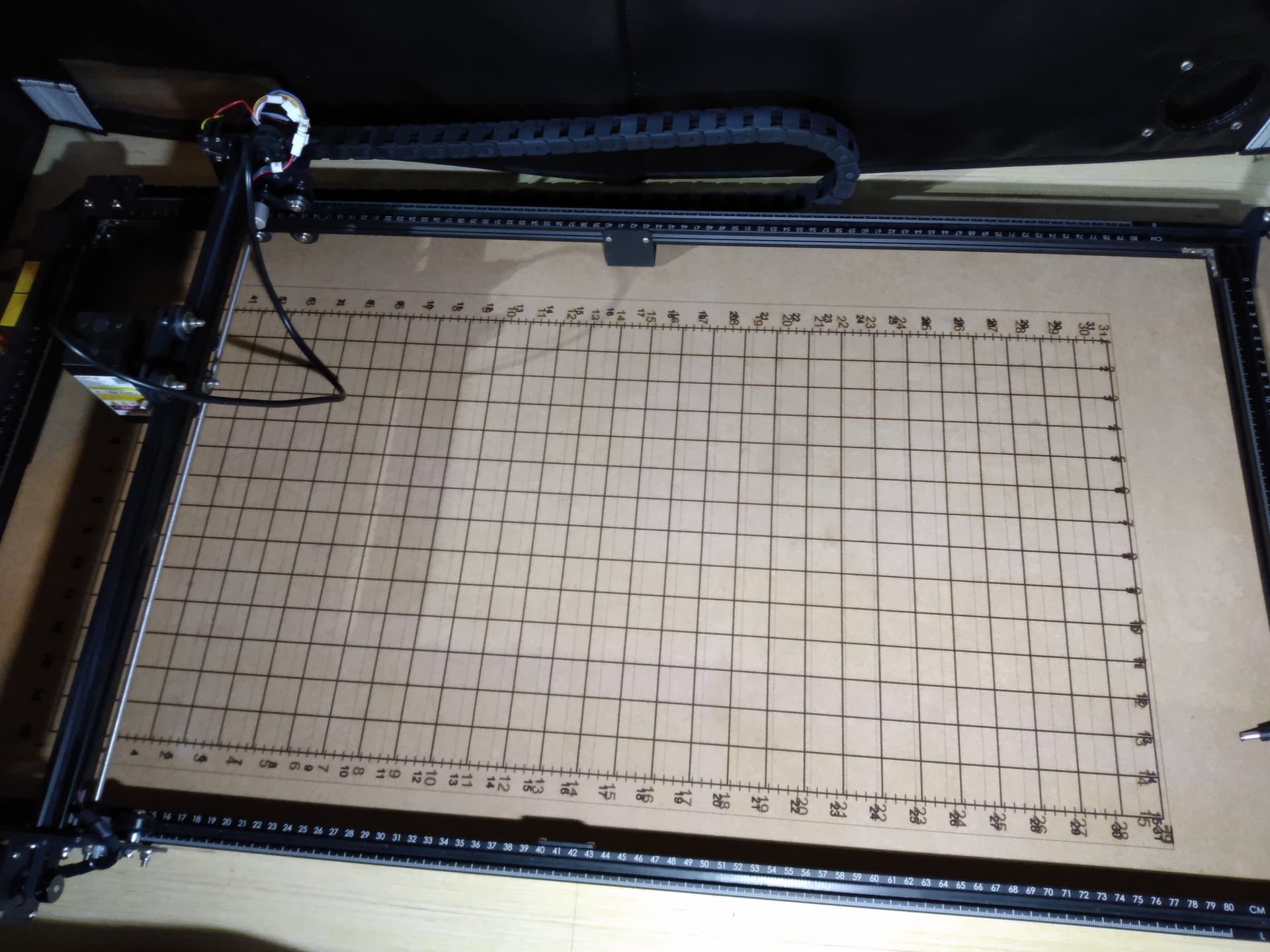 Waste board grid pattern engraving is using Ortur Laser